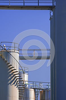 Cone storage tanks with silos system against blue sky in chemical and petroleum industrial area