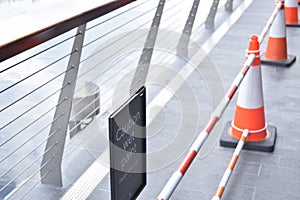 Cones in a line on a bridge