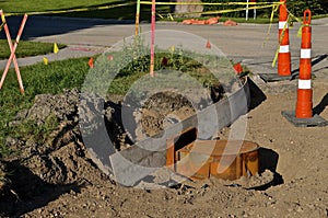 Cones surround a curb construction project