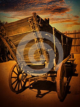 Vintage Conestoga wagon at sunset photo