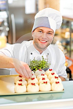 Confectioner with cakes