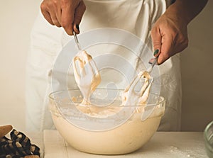 Confectioner girl is preparing a cake. Concept ingredients for cooking flour products or dessert