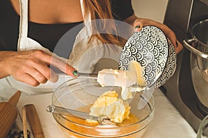 Confectioner girl is preparing a cake. Concept ingredients for cooking flour products or dessert