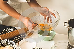 Confectioner girl is preparing a cake. Concept ingredients for cooking flour products or dessert