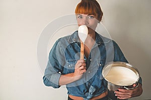 Confectioner girl preparing cream for cake. Concept ingredients for cooking flour products or dessert