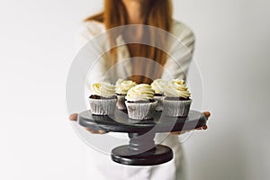 Confectioner girl is preparing a cupcakes. Concept ingredients for cooking flour products or dessert