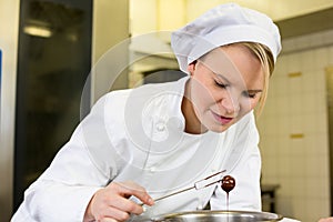 Confectioner producing filled chocolates