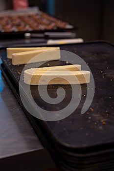 Confectioner works the puff pastry dough, artisan, gourmet, prepared to be baked photo