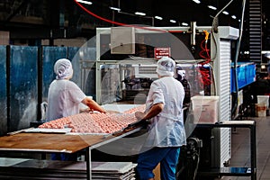 Confectioners works on marshmallow production line