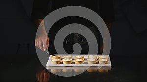 Confectionery creating cupcakes by confectioner syringe photo