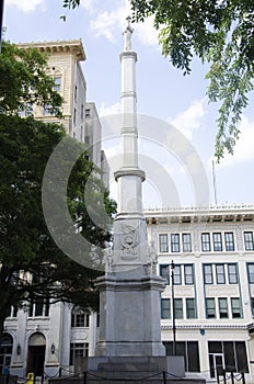 A Confederate monument in Augusta, Georgia, with statues of soldiers and the words Deo Vindice With God As Our Defender engraved