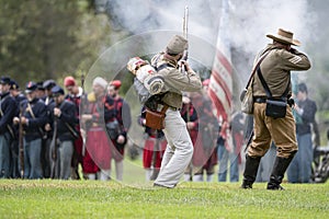 Confederate soldiers shooting at Union troops