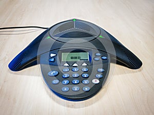 Conference call telephone on table