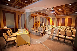 Conference hall. Many beautiful chairs and the podium are empty