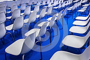 Conference hall, a row of white chairs for business meetings