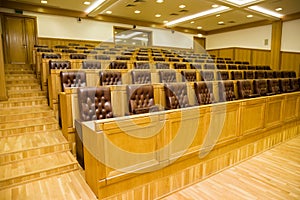 Conference halls with leather armchairs and tables photo