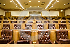 Conference halls with leather armchairs and tables photo