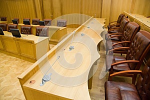 Conference halls with leather armchairs and tables photo