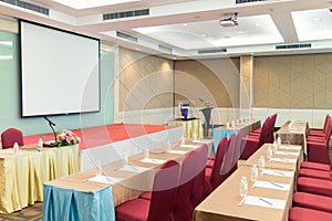 Conference Meeting Room , Row of  Chairs with Stage and Empty Screen for Business Meeting, Conference, Training Course, used as