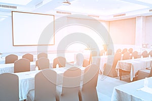 Conference Meeting Room , Row of  Chairs with Stage and Empty Screen for Business Meeting, Conference, Training Course, used as