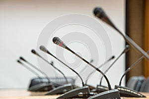 before a conference, the microphones in front of empty chairs.Selective focus.