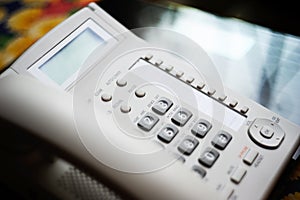 Conference phone on executive glass table