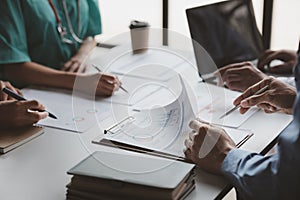 A conference room in a hospital where a group of doctors are attending a meeting, a meeting of executive doctors and chiefs