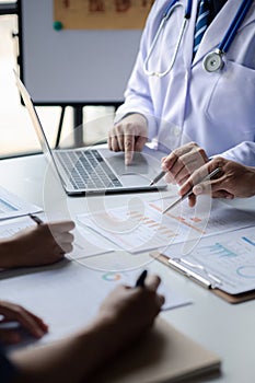 A conference room in a hospital where a group of doctors are attending a meeting, a meeting of executive doctors and chiefs