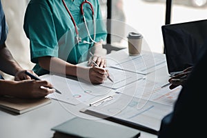 A conference room in a hospital where a group of doctors are attending a meeting, a meeting of executive doctors and chiefs