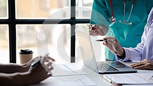 A conference room in a hospital where a group of doctors are attending a meeting, a meeting of executive doctors and chiefs