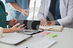 A conference room in a hospital where a group of doctors are attending a meeting, a meeting of executive doctors and chiefs