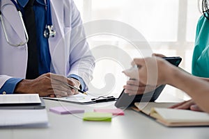 A conference room in a hospital where a group of doctors are attending a meeting, a meeting of executive doctors and chiefs