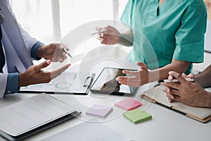 A conference room in a hospital where a group of doctors are attending a meeting, a meeting of executive doctors and chiefs