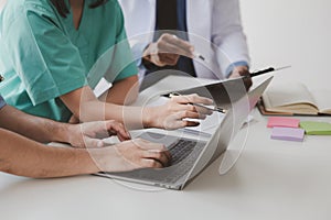 A conference room in a hospital where a group of doctors are attending a meeting, a meeting of executive doctors and chiefs