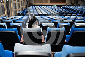 Conference room with many blue and gray seats