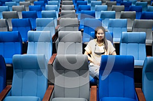 Conference room with many blue and gray seats