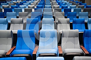 Conference room with many blue and gray seats