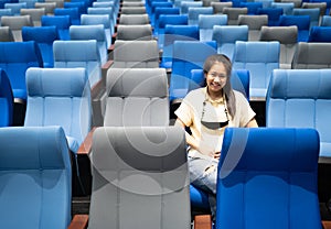 Conference room with many blue and gray seats