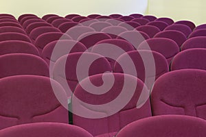 Conference room seats in red tone. Empty classroom