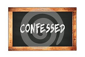 CONFESSED text written on wooden frame school blackboard photo