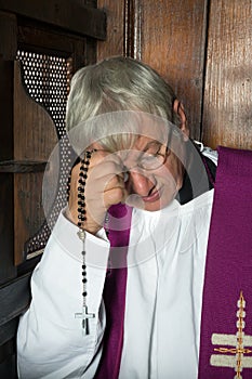 Confession box and priest photo