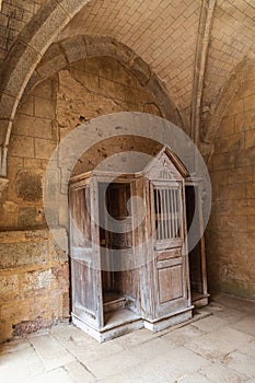 Confessional in the ruined stone church in the martyr village of Oradour-sur-Glane