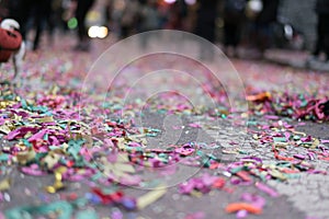Confetti after a celebration or parade, with a close ground view