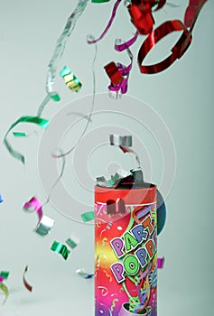 Confetti shooting from a party popper
