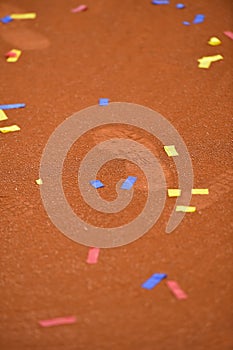 Confetti on a tennis clay court