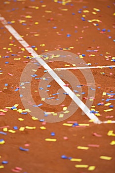 Confetti on a tennis clay court