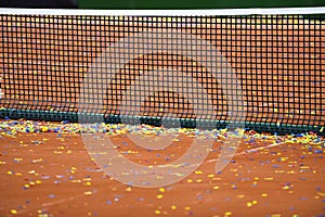 Confetti on a tennis clay court