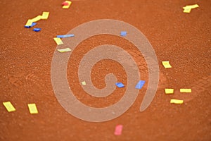 Confetti on a tennis clay court