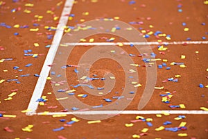 Confetti on a tennis clay court