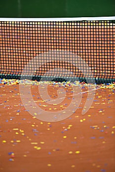 Confetti on a tennis clay court